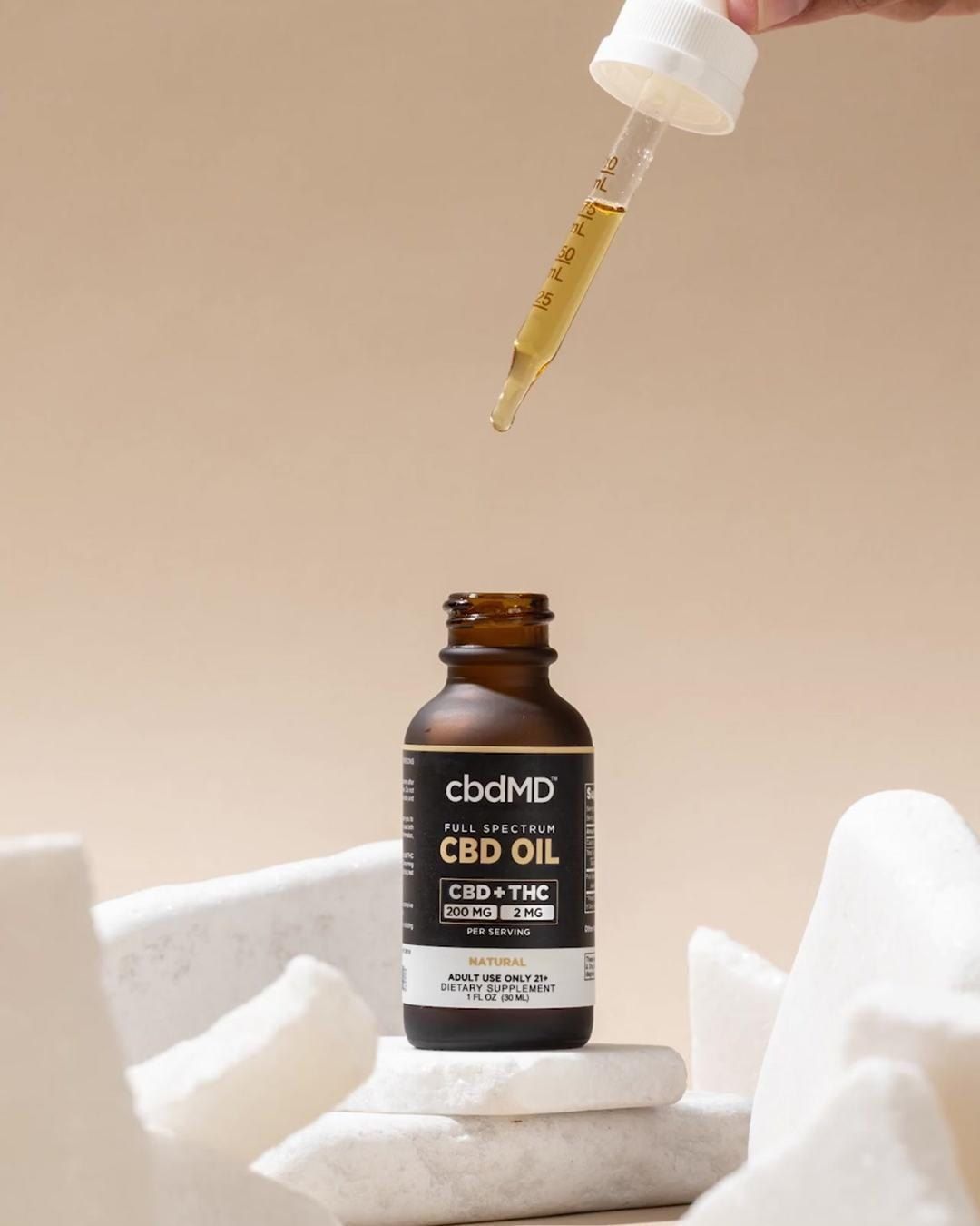 cbdMD oil bottle with dropper