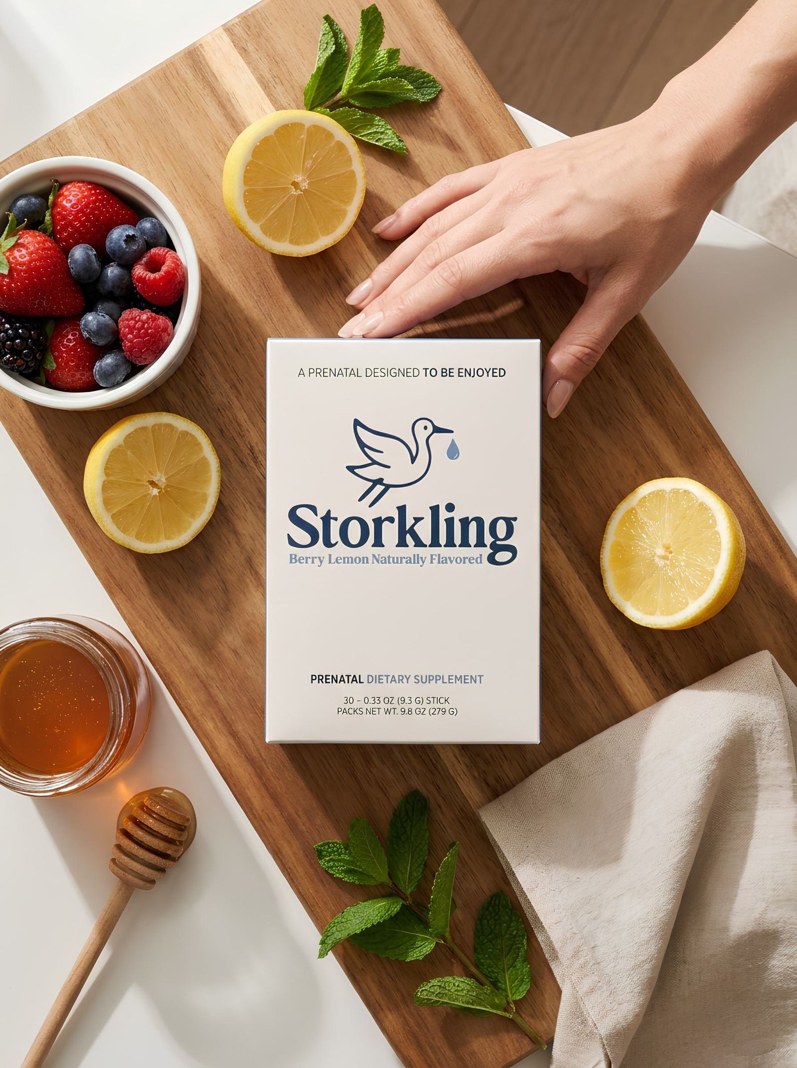 Storkling box on a cutting board with citrus and berries
